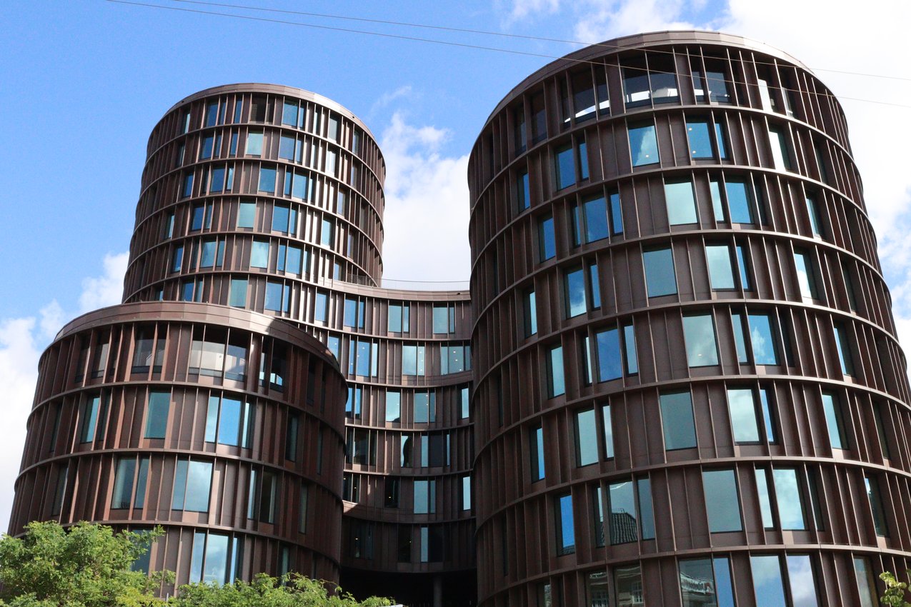 The rust-colored cylinders of Axel Towers, Copenhagen