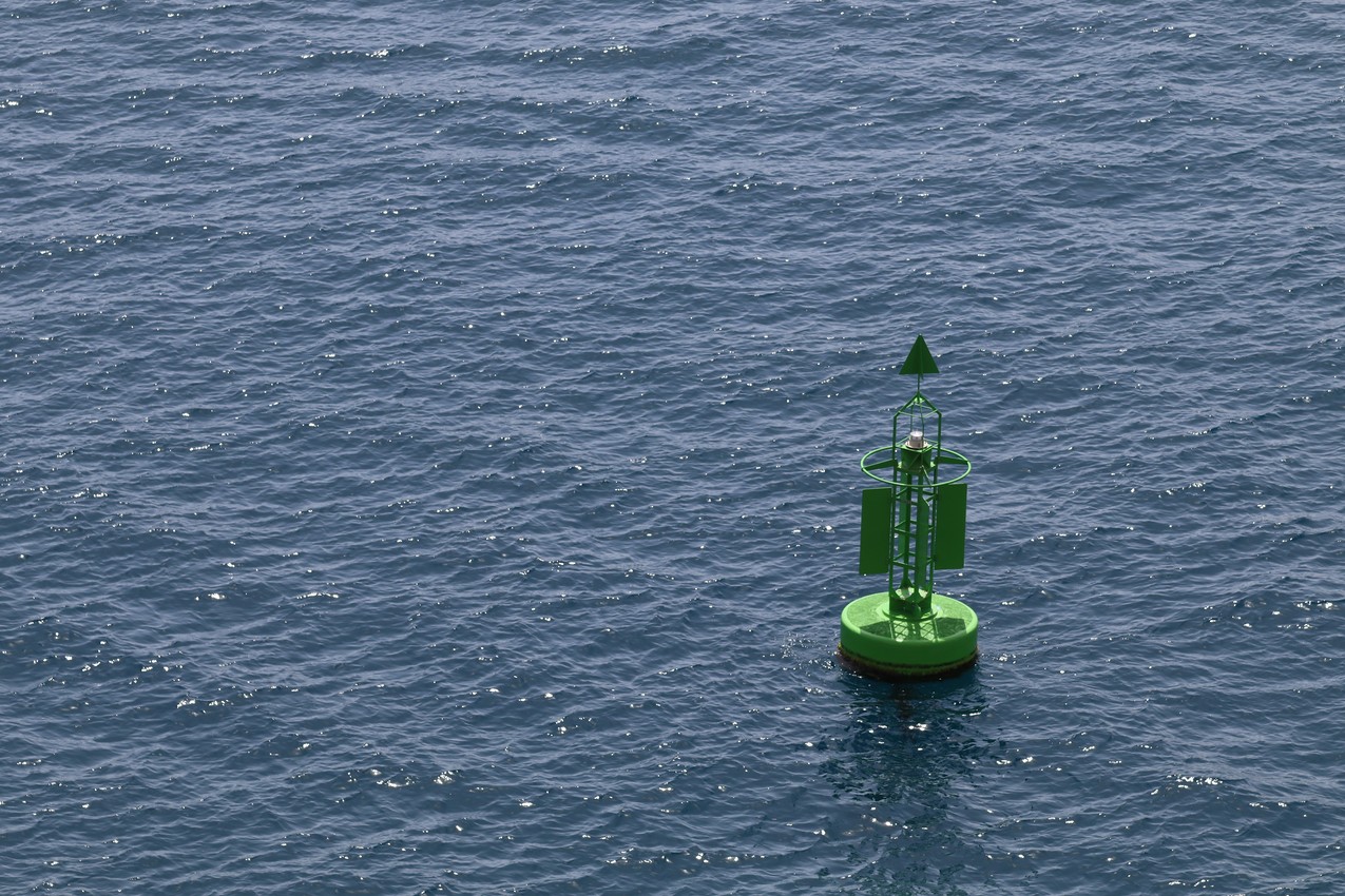 A Green Buoy in a Blue Sea