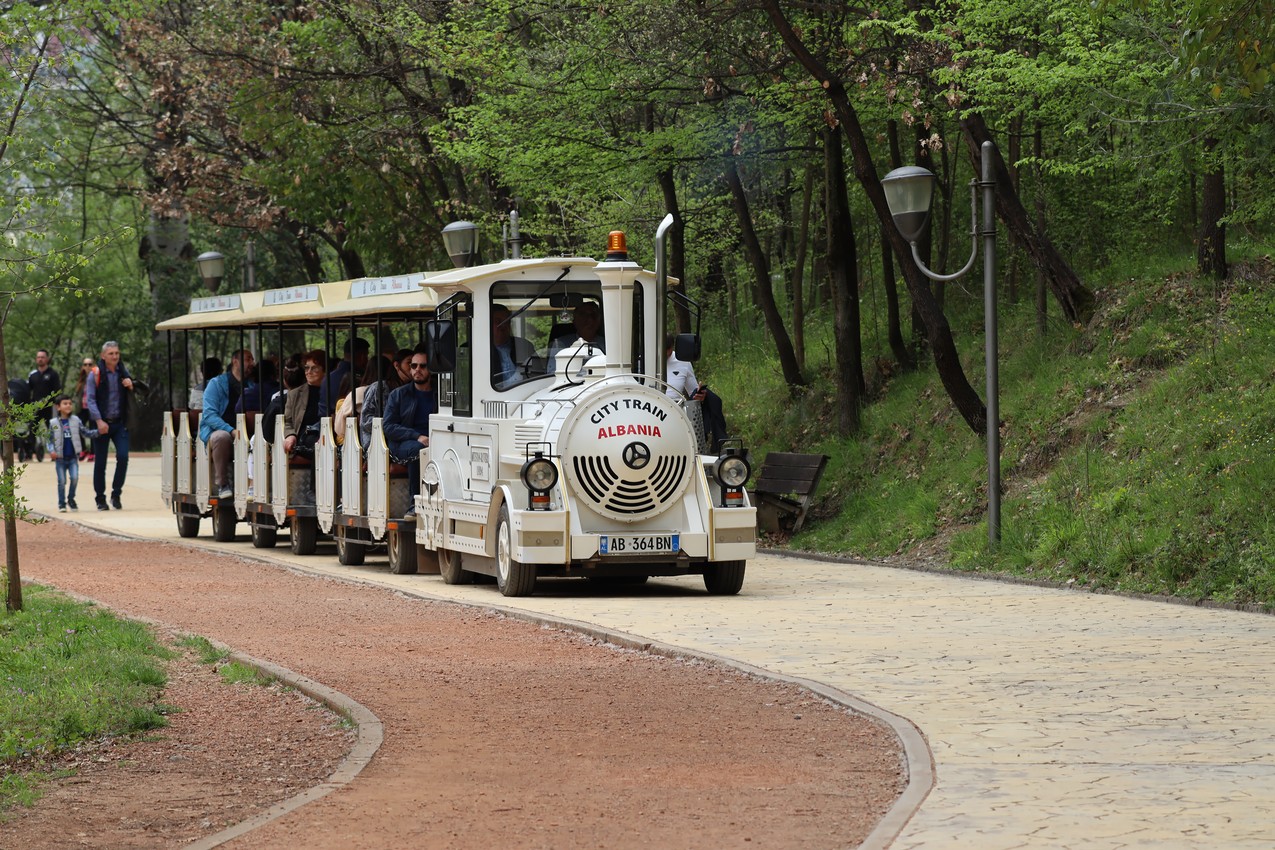 A faux train driving visitors around a park, Tirana
