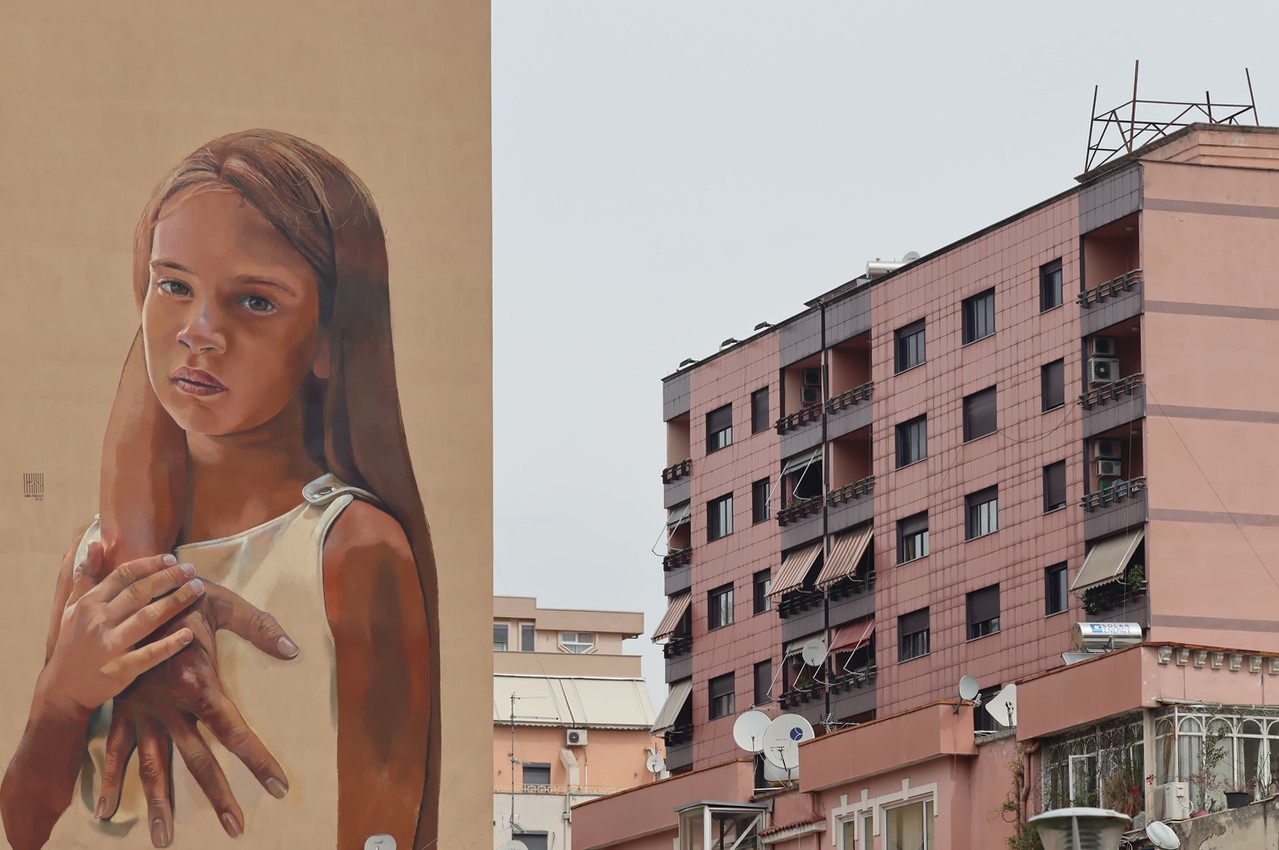 Street art in Albania depicting a young girl