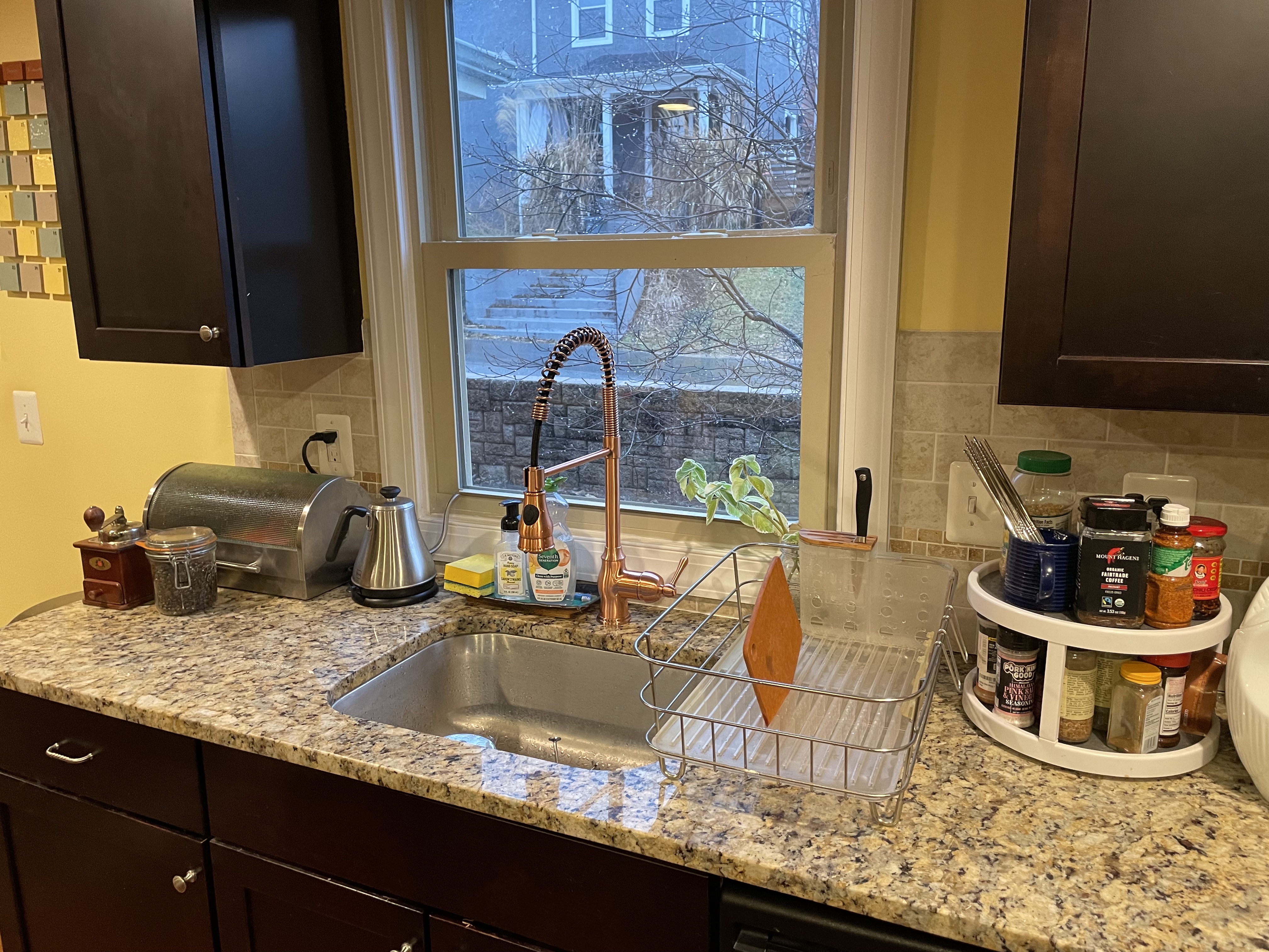 Kitchen counter after, with a pro-style copper faucet and less clutter