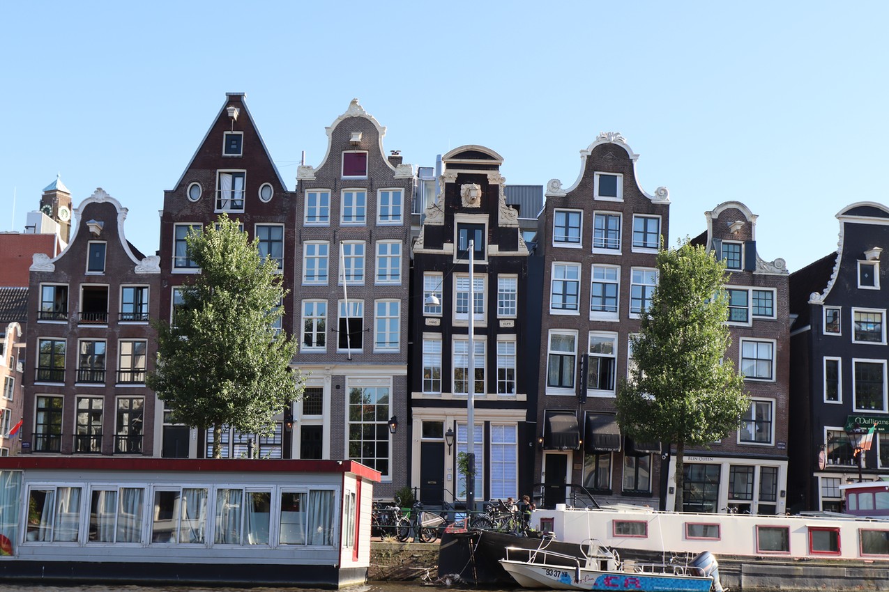 Crooked houses before a canal