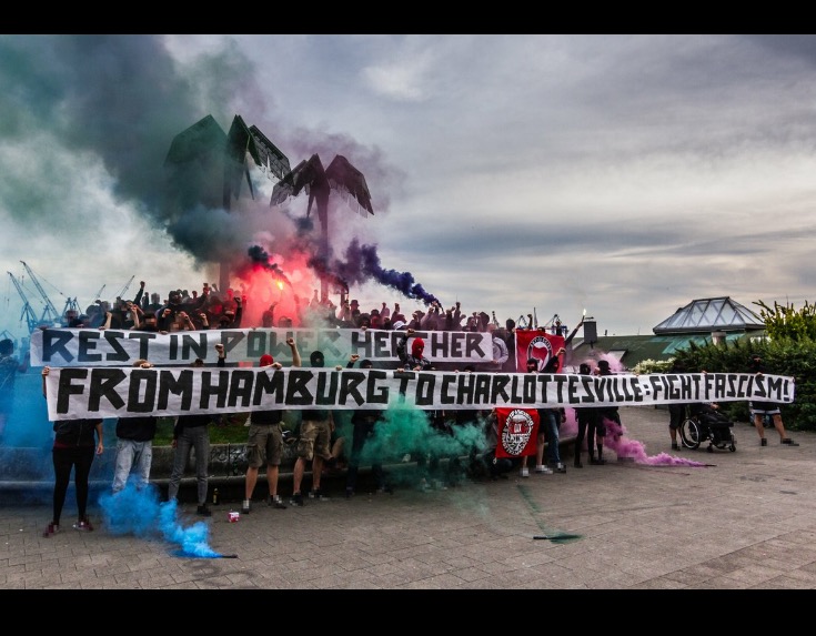 Hamburg antifascists hold a banner in solidarity with Charlottesville.